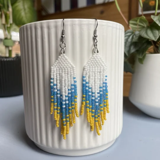 Handmade beaded Earrings

Where colours cascade in a breathtaking display of vibrancy and elegance. Each bead is carefully selected to create a mesmerising gradient effect, reminiscent of a cascading waterfall of hues. 

White, Blue and Yello