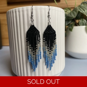 Handmade beaded Earrings

Where colours cascade in a breathtaking display of vibrancy and elegance. Each bead is carefully selected to create a mesmerising gradient effect, reminiscent of a cascading waterfall of hues. 

Sparkley Black, Silver and Blue