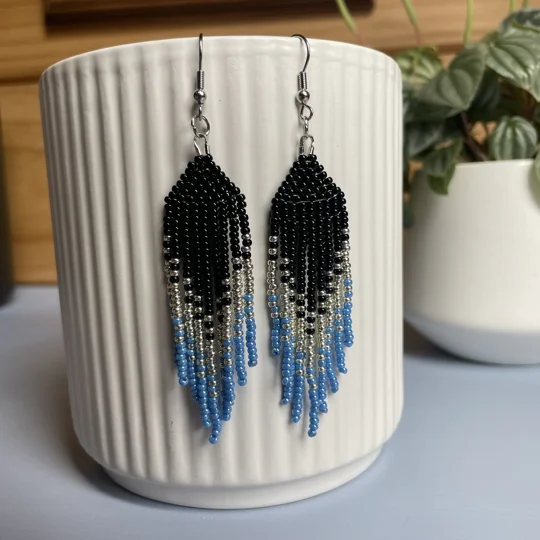 Handmade beaded Earrings

Where colours cascade in a breathtaking display of vibrancy and elegance. Each bead is carefully selected to create a mesmerising gradient effect, reminiscent of a cascading waterfall of hues. 

Sparkley Black, Silver and Blue