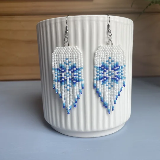 handcrafted Christmas earrings in classic white and hues of blue. Snowflake design