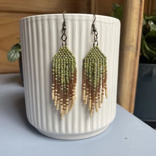 These are a symphony of nature's palette: rich forest greens, delicate creams, and a whisper of golden sunlight - reminiscent of a serene stroll under the mystical canopy of an age-old woodland.