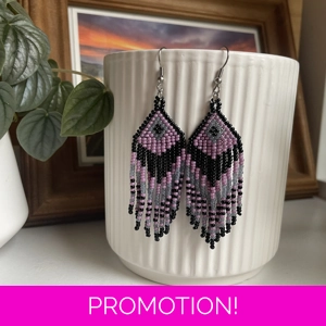 Handmade beaded Earrings

Where colours cascade in a breathtaking display of vibrancy and elegance. Each bead is carefully selected to create a mesmerising gradient effect, reminiscent of a cascading waterfall of hues. 

Black, Purple, and frosted grey