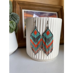 Handmade beaded Earrings

Where colours cascade in a breathtaking display of vibrancy and elegance. Each bead is carefully selected to create a mesmerising gradient effect, reminiscent of a cascading waterfall of hues. 

Grey, Turquoise, and Bright Orange