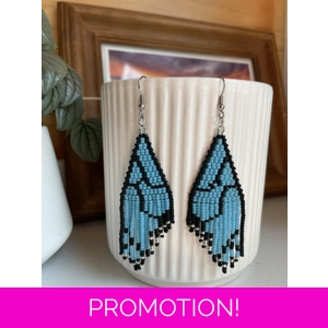 Unique earrings feature intricate beadwork, capturing the delicate charm of butterfly wings in vibrant blue