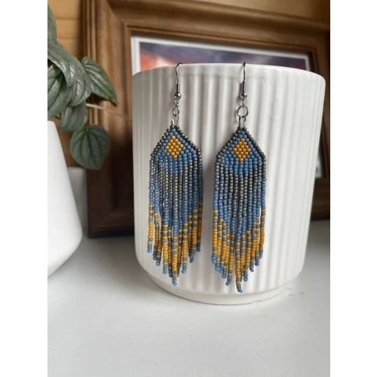 Designed to evoke a sense of movement and vivacity.

Mustard, Grey, and Teal Colors