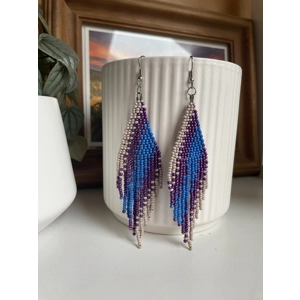 A pair of handmade beaded fringe earrings. Colors in a gradient Beige, Purple, and blue