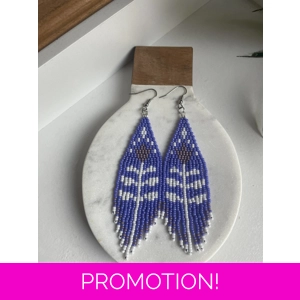 A pair of handmade beading earrings. In purple with a white tulip flower with mauve coloured petals