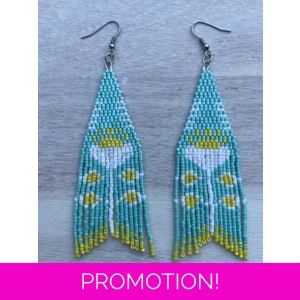 A pair of handmade beading earrings. in turquoise with a peony folk flower in white.