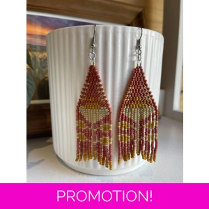 A pair of handmade beading earrings. in matte red with a peony folk flower in beige.