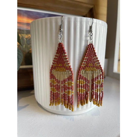 A pair of handmade beading earrings. in matte red with a peony folk flower in beige.