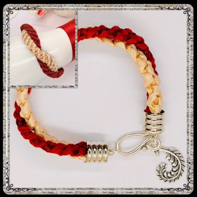 Red and Cream Twin Flat Braids Entwined Bracelet With Silver Feather dangle Charm Red and Cream Twin Flat Braids Entwined Bracelet With Silver Feather dangle Charm
