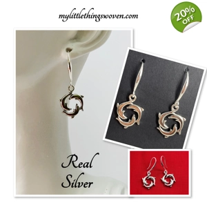 Silver Dolphins Swimmin..