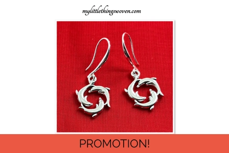 Silver Dolphins Swimming Earrings, for pierced ears.Silver..