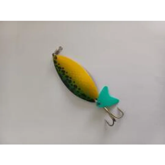 Shakespeare Devil's Own Squid Pirk 25g yellow and green sea fishing lure with pink tail.