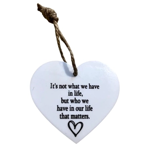 It's not what we have in life Heart shaped plaque / Sign