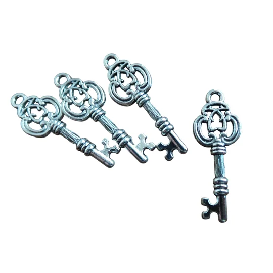Group of 4 key charms