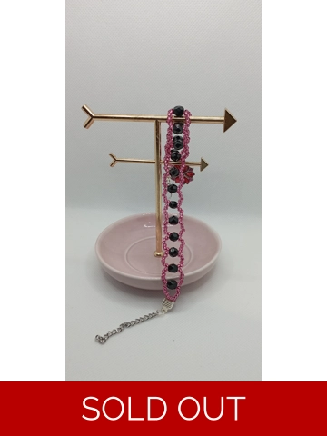 Black and dark Pink beaded bracelet with flower charm