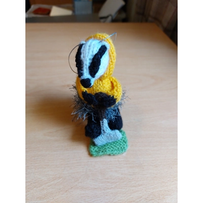 Mini badger mowing the lawn