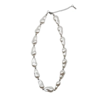 Necklace with assymetrical pearls..