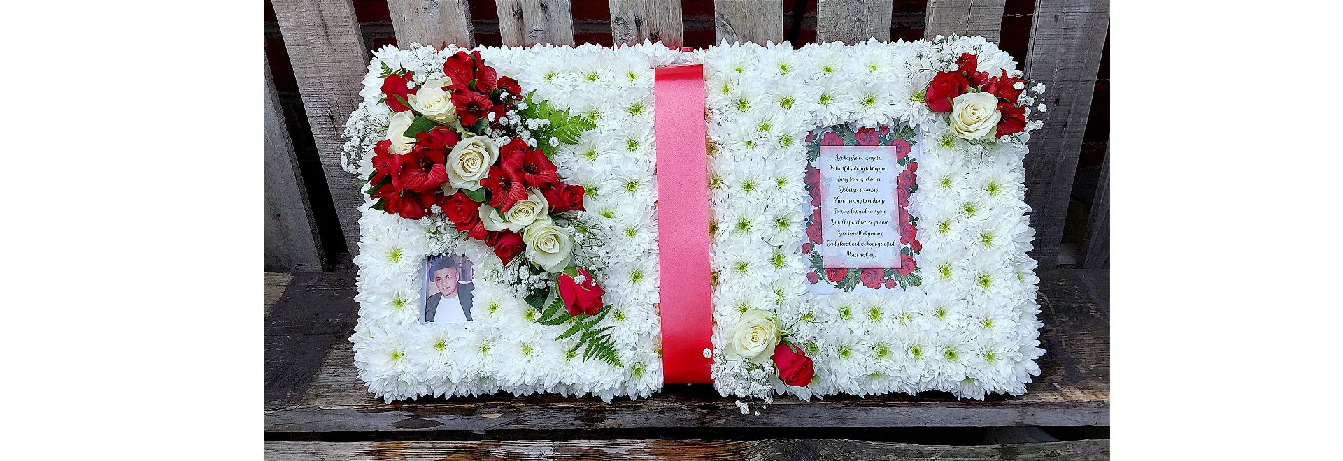 open book funeral tribute in red and white with personalised verse and photo