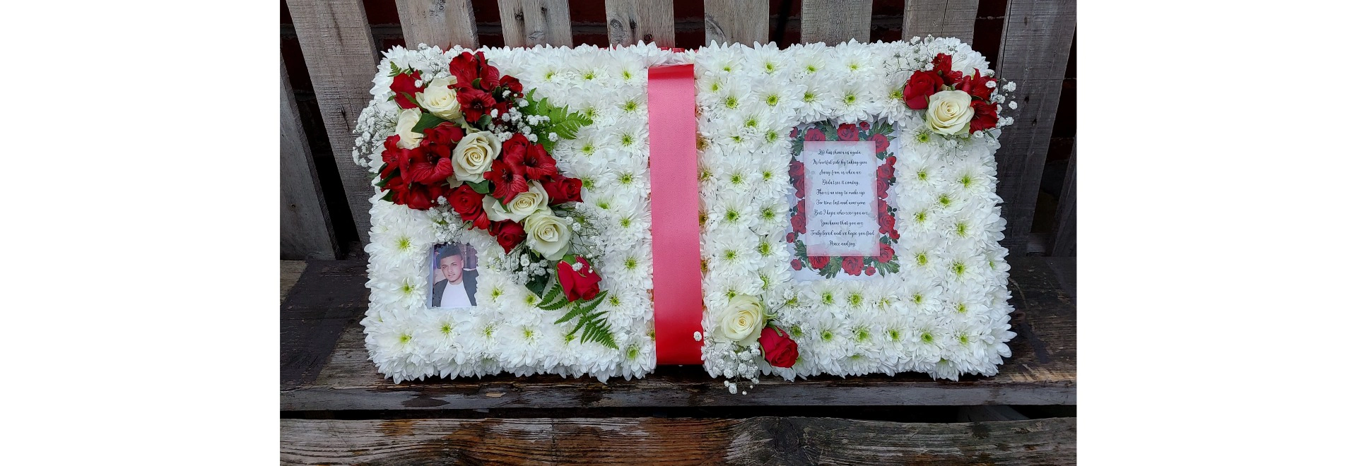 open book funeral tribute in red and white with personalised verse and photo