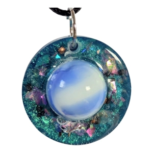 Cosmic pendant with EMF protection