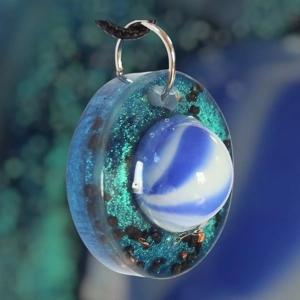 Cosmic pendant with EMF protection representing Earth.