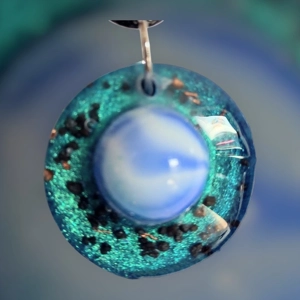 Cosmic pendant with EMF protection representing Earth.