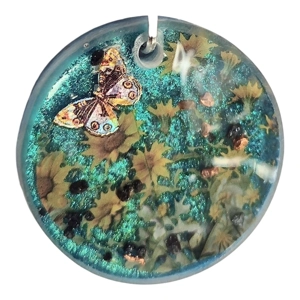 Reiki charged handmade pendant flowers at night with moth