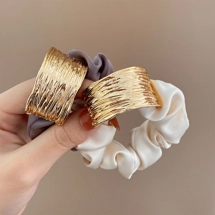 Hair tie with textured ..