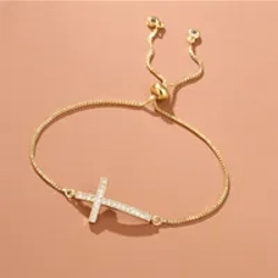 Zircon bracelet with cross pendant