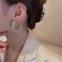 Glam twisted hoop earri..