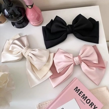 Triple layered bow clip