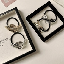 Hair tie with metal cuf..