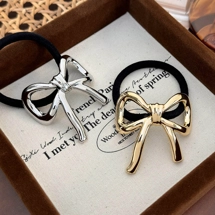 Hair tie with metal bow..