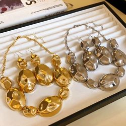 Beaten metal effect necklace and drop earrings set