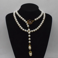 Long artificial pearl necklace with flower pendant