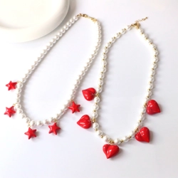 Artificial pearl necklace with charms