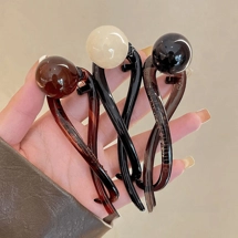 Twist hair clip with la..