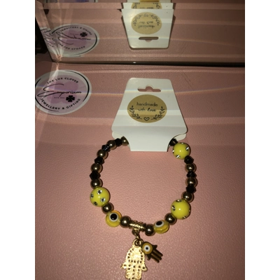Ladies evil eye bracelet black and yellow with Fatima hand.. Ladies evil eye bracelet black and yellow with Fatima hand..
