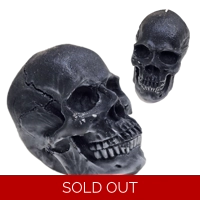 Big Decorative Pillar Candle Skull Old Rock On the Pathway..