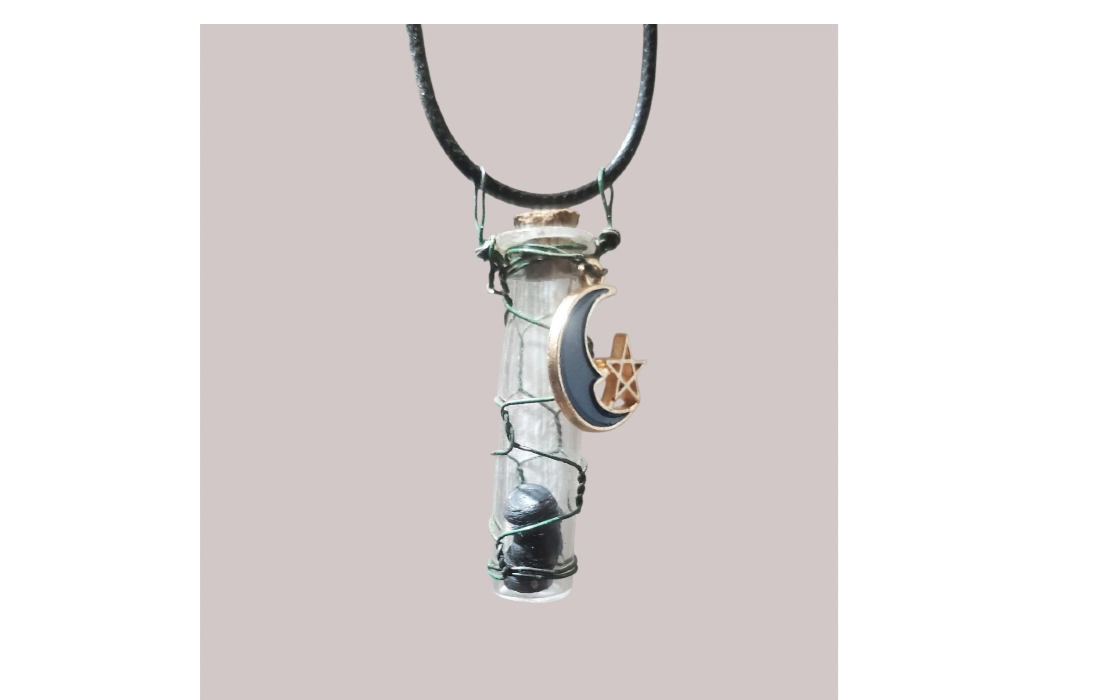 Glass bottle necklace with Joshua Tree Seeds